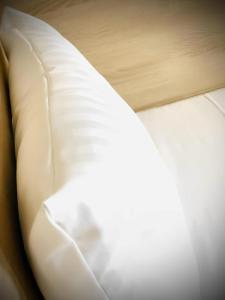 a close up of a white pillow on a bed at Check-in Hamburg in Hamburg