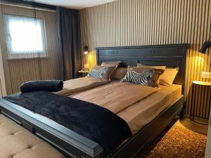 Ένα ή περισσότερα κρεβάτια σε δωμάτιο στο Villa Pauline - FeWo "Champagne"