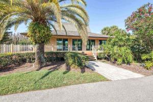 a palm tree in front of a house at Canopy on Cobblestone in Wesley Chapel