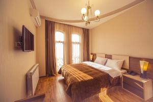 TV a/nebo společenská místnost v ubytování Royal Venezia Hotel