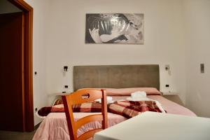 Postel nebo postele na pokoji v ubytování B&B Aurora