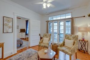 a living room with two chairs and a table at Walkable Savannah Escape in Historic District! in Savannah