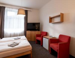 Llit o llits en una habitació de Hotel U Berounky