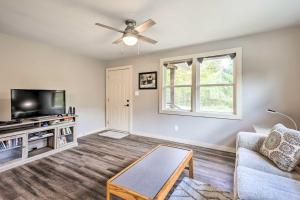a living room with a couch and a tv at Charming Retreat, 13 Mi to Grandfather Mtn! in Newland