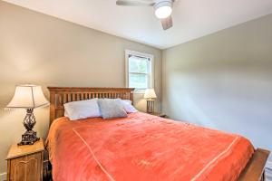a bedroom with a large bed and a window at Charming Retreat, 13 Mi to Grandfather Mtn! in Newland