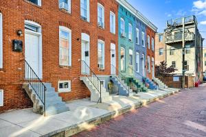 a brick building with stairs on the side of it at Central and Trendy Baltimore Townhome Pets OK! in Baltimore