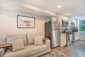 a living room with a couch and a refrigerator at Central and Trendy Baltimore Townhome Pets OK! in Baltimore