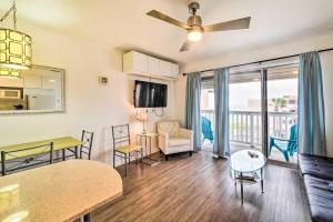 a living room with a table and a dining room at Sun-Soaked Texas Condo with North Beach Access! in Corpus Christi