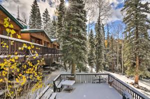a winter view of a cabin with snow on the porch at The Cottages Ski-InandOut Retreat - Hike and Explore! in Beaver