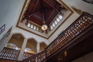 a building with a wooden staircase with a ceiling at Mellington Hall Country House Hotel in Church Stoke +9 photos