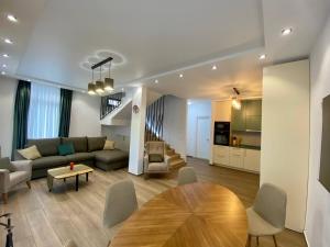 a living room with a couch and a table at European Village Old Villa 6 in Gonio