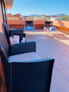 a group of chairs and tables on a patio at Villa Marogna in Alghero