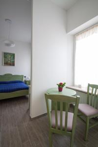 A bed or beds in a room at Palazzo di Primavera Guest House