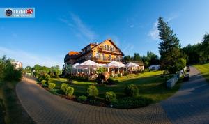 Vonkajšia záhrada v ubytovaní Hotel Słoneczny Brzeg