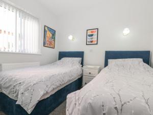 Postel nebo postele na pokoji v ubytování Southview Bungalow