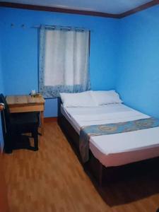 Postel nebo postele na pokoji v ubytování JayDin Travellers Inn