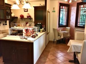Kuchyň nebo kuchyňský kout v ubytování B&B Desenzano Paradise