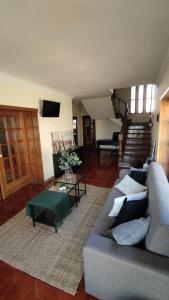 a living room with a couch and a table at Hostel Summer House in Vila Nova de Gaia