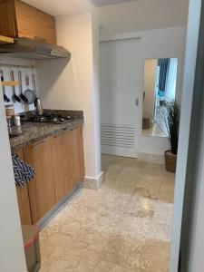 a kitchen with a sink and a counter top at Acogedor departamento en Playa Dorada in San Felipe de Puerto Plata