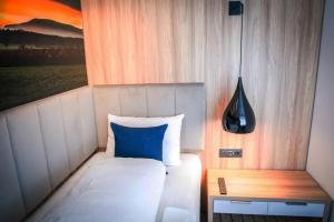 Postel nebo postele na pokoji v ubytování Hotel Wilder Mann