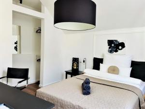 a bedroom with a bed with a black and white at Gallery Room 02 in Bielefeld