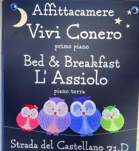 een bord met drie uilen op een paal bij B&B L'Assiolo in Ancona