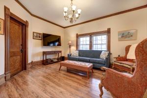 a living room with a couch and a chair at Roomy Vacation Rental in Downtown Fort Wayne! in Fort Wayne