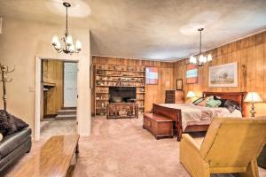 a bedroom with a bed and a fireplace at Charming Aiken Vacation Rental 2 Mi to Dtwn! in Aiken
