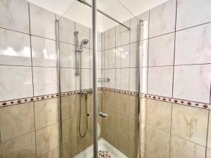 a shower with a glass door in a bathroom at Apartments Kate in Dramalj +25 photos