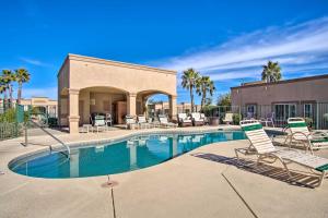 a swimming pool with lounge chairs and a patio at Green Valley Studio in 55 and Community! in Green Valley