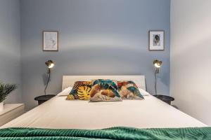 A bed or beds in a room at Design Apartments Sassari-Via Roma