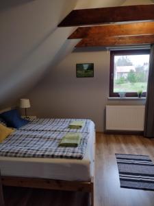 Posteľ alebo postele v izbe v ubytovaní Dom Mazurska Apartamenty