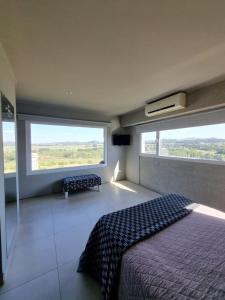 Giường trong phòng chung tại La Casa de los Vientos