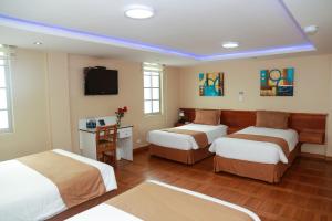 Letto o letti in una camera di Hotel Carolina Montecarlo