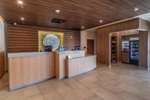 a lobby with a counter in a restaurant at Fairfield Inn & Suites by Marriott Brownsville North in Brownsville