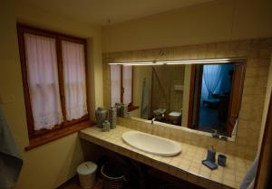 a bathroom with a sink and a mirror at Villa Limone in Limone sul Garda