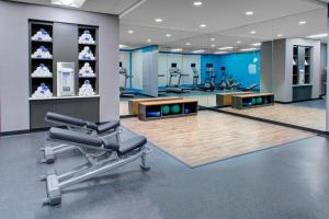 a gym with a chair in the middle of a room at Fairfield Inn & Suites by Marriott Bakersfield North/Airport in Bakersfield