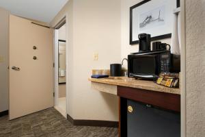 a kitchen with a microwave and a coffee maker on a counter at Springhill Suites by Marriott Jacksonville Airport in Jacksonville