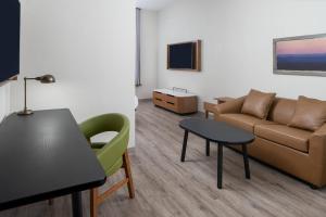 a living room with a couch and a table at Fairfield Inn and Suites by Marriott Lake Charles - Sulphur in Sulphur