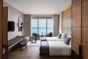 a hotel room with two beds and a view of the ocean at JW Marriott Hotel Istanbul Marmara Sea in Istanbul