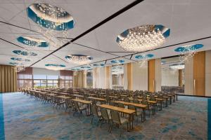 a large room with chairs and tables and chandeliers at JW Marriott Hotel Istanbul Marmara Sea in Istanbul +37 photos
