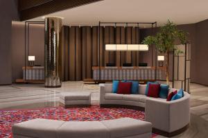 a lobby with two couches and a rug at JW Marriott Hotel Istanbul Marmara Sea in Istanbul