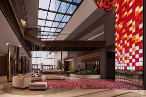 a lobby of a hotel with a large glass ceiling at JW Marriott Hotel Istanbul Marmara Sea in Istanbul