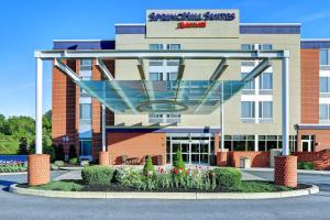 a building with a sign that reads saving inn suites at SpringHill Suites Harrisburg Hershey in Harrisburg