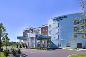 a rendering of the front of a hotel at Courtyard by Marriott Columbus Grove City in Grove City