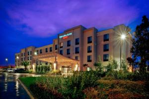 a hotel building at night with a purple sky at SpringHill Suites by Marriott Baton Rouge North / Airport in Baton Rouge