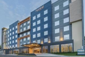 a hotel building with a sign that reads brabus at Fairfield by Marriott San Jose Airport Alajuela in Alajuela City