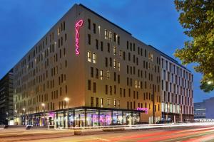 a building with a sign on the side of it at MOXY Frankfurt East in Frankfurt