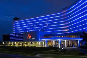 a large building with a mriott sign at night at Clearwater Beach Marriott Suites on Sand Key in Clearwater Beach