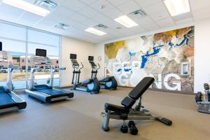 a gym with treadmills and cardio equipment in a room at SpringHill Suites by Marriott Columbia in Columbia